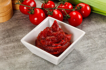 Red tomato paste in the bowl