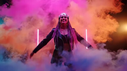 Woman poses in neon studio. Model stands centered with confident posture. Portrait shows cyberpunk vibe with smoke and neon light. Goggle and braid detail adds edgy jacket silhouette. Neon glow art.