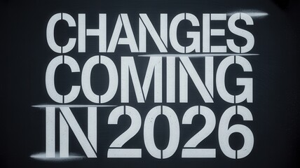 Stenciled announcement proclaiming alterations arriving in the year twenty twenty six displayed on a dark surface