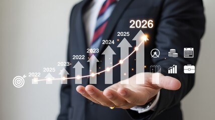 Business professional presents upward trending annual growth projection extending to the year 2026