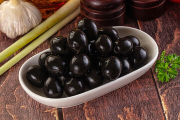 Mediterranean marinated Black olives in the bowl