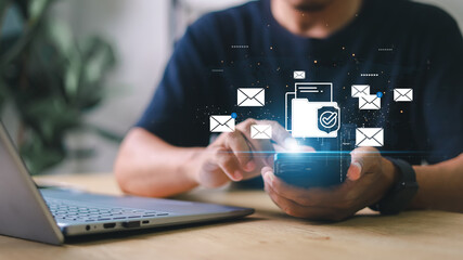 Person checking smartphone with email icons floating above. Concept of digital communication, mobile inbox, real-time notification, and online message system.