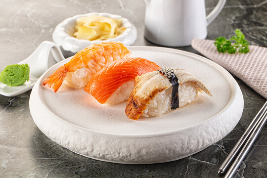 Japanese cuisine - sushi with eel, salmon and prawn