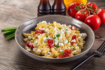 Italian pasta fusili with curd