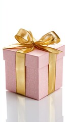 Obraz premium A beautifully wrapped pink gift box adorned with a shiny gold ribbon, perfect for celebrations and special occasions.