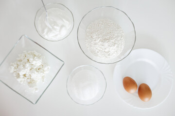 Ingredients for baking a delicious pastry on white table