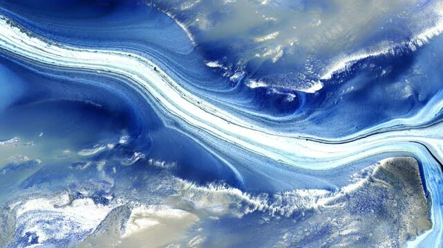 Macro video of flowing blue and white paint river texture