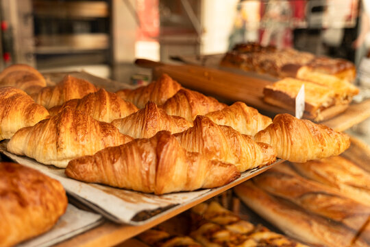 Paris France fresh baked croissant in boulangerie bakery window