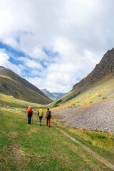 Fototapeta premium Kaçkar Mountains trekking routes. People trekking in the magnificent Kaçkar Mountains. Trekking groups. Kaçkar Dilberdüzü route. Yusufeli Olgunlar Plateau. Artvin, Türkiye.