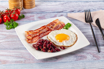 English breakfast with egg, bean and bacon