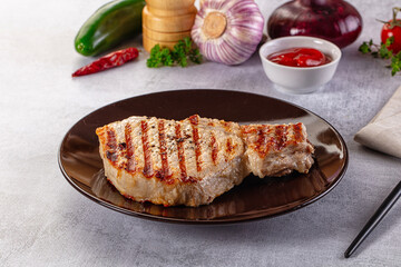 Tasty hot grilled bone steak served sauce