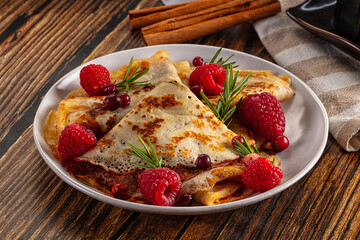 Sweet homemade pancakes with raspberry