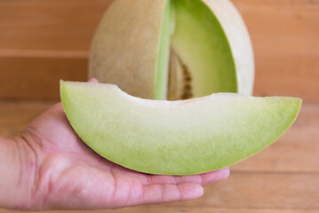a piece of fresh white melon on the plate  