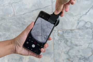 Use Closeup extra lense set with smartphone to take the photo