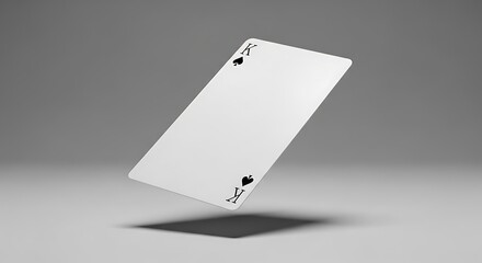 A lone Ace of Spades playing card gracefully floats above a smooth grey surface casting a subtle shadow