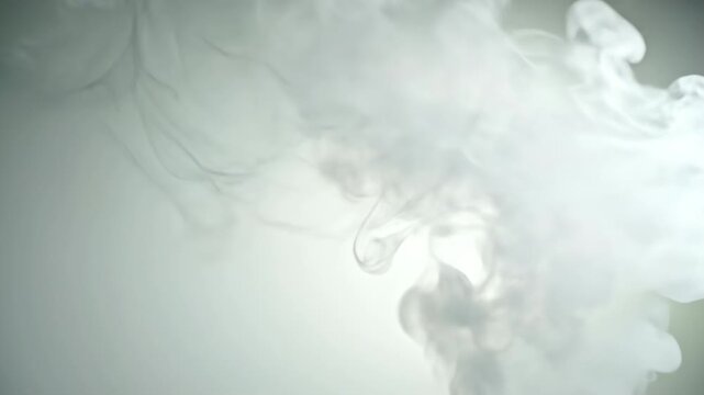 Extremely slow motion of transparent white smoke wisps floating gently and spreading across a very light translucent backdrop flowing, smoke, presentation