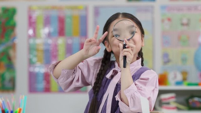 Curious Schoolgirl Examines Classroom With Magnifying Glass