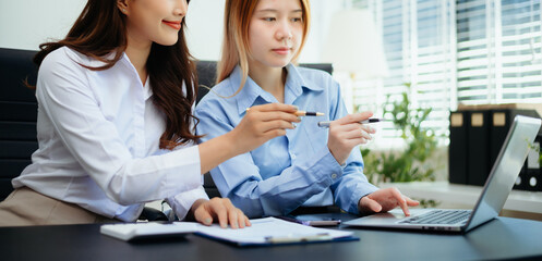 Business team collaboration discussing working analyzing with financial data and marketing growth report graph in team, presentation and digital tablet, laptop.