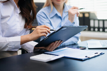 Business team collaboration discussing working analyzing with financial data and marketing growth report graph in team, presentation and digital tablet, laptop.