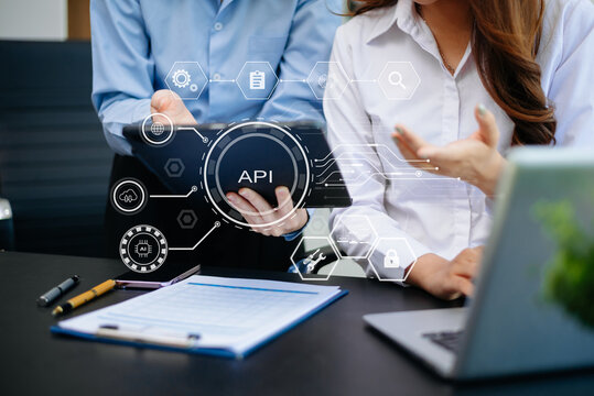 API Application Programming Interface, woman using laptop, tablet and smartphone with virtual screen API icon Software development tool, modern technology - Powered by Adobe