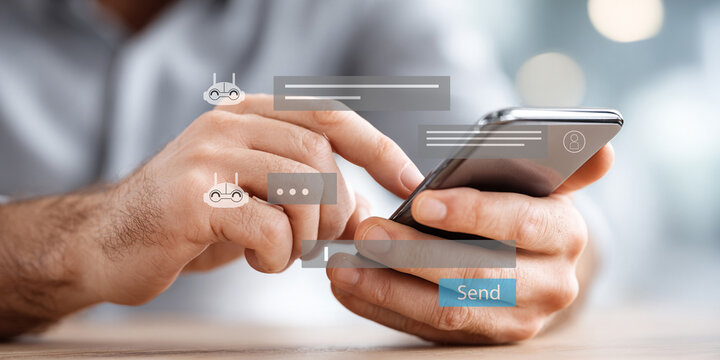 Hands typing on smartphone with chatbot interface and message icons.