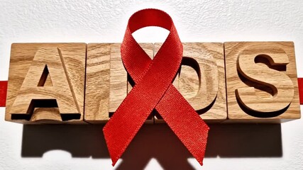 A conceptual composition designed to raise awareness about Acquired Immune Deficiency Syndrome (AIDS) and its treatment, arranged as a flat lay.