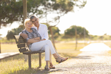 Fototapeta premium Happy senior couple embracing, enjoying leisure in park