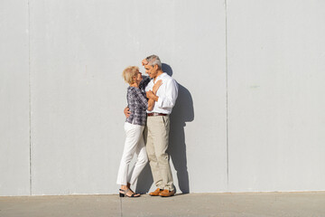 Happy senior couple embracing, showing love and affection