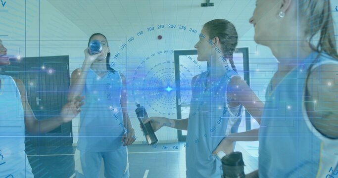 Chatting female athletes holding water bottles in gym hall, wearing light-blue jerseys, HUD overlay - Powered by Adobe