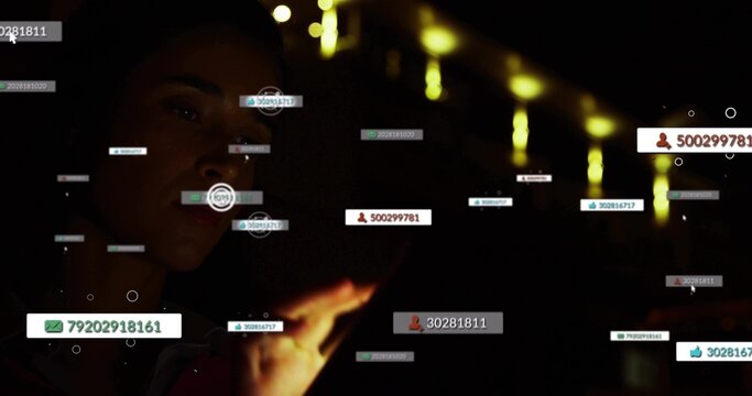 Holding handheld phone, woman in dark jacket tapping numeric UI tags at night, copy space