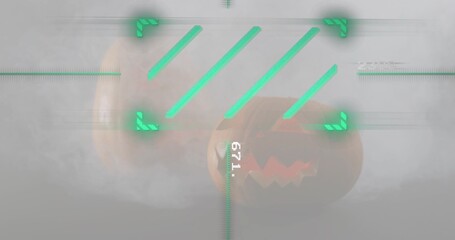 Fototapeta premium Displaying pair of carved pumpkins glowing in gray studio, with fog and neon-green HUD readout 671
