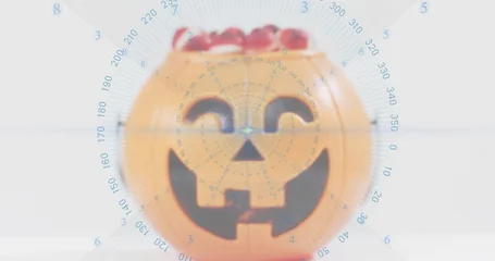 Fotobehang Vlees Displaying orange pumpkin bucket sitting on pale table, showing red candy and blue radar overlay  © vectorfusionart