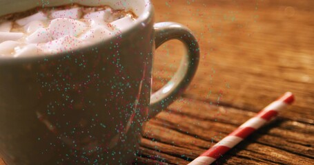 Showing ceramic mug with cocoa topped marshmallows on wood table red straw handle right, copy space © vectorfusionart