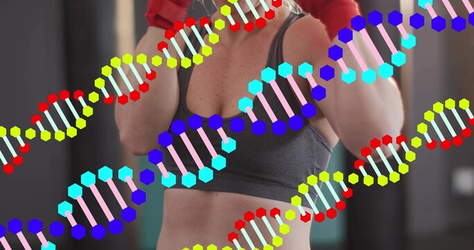 Holding guard adult female wearing gray sports bra raising red gloves at gym, with DNA overlays - Powered by Adobe