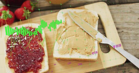 Showing bread slices sitting on cutting board bearing jam and peanut spread, knife, green overlay