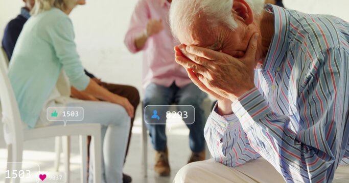 Leaning senior man covering face in group room, wearing striped shirt, social overlays, copy space