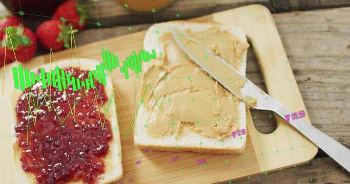Showing bread slices sitting on cutting board bearing jam and peanut spread, knife, green overlay