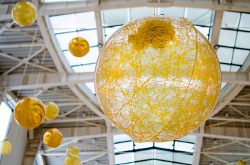 Large golden hanging decorations in mall