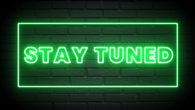 Green Neon Stay Tuned Text Sign on Dark Brick Wall