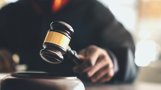 Judge with gavel on table