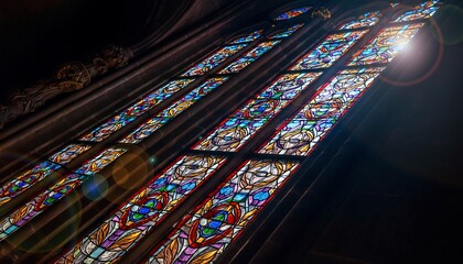 Colorful Stained Glass Windows in Gothic Cathedral with Sunlight Streaming in
