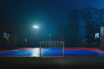 School basketball court at night in autumn
