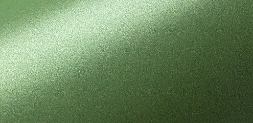 Deep forest green paper background with a smooth matte texture and subtle wavy edges. Rich basil and