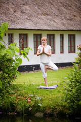 Prayer hands, yoga and peace with woman outdoor for zen exercise, mindfulness and spirituality. Mental health, healing aura and meditation with person in nature for holistic, awareness and calm