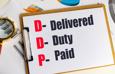  DDP incoterm acronym with delivered duty paid text on clipboard and financial charts