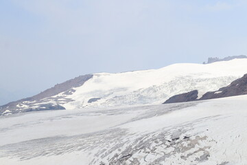 The Bolshoi Azau glacier on the slopes of Elbrus on a sunny summer day