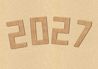 chiffres en bois &eacute;crivant 2027 sur un fond de papier kraft