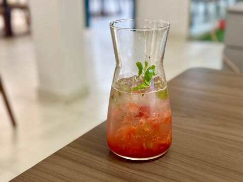 Summer drink concept, strawberry mocktail with mint leaves in clear mason jar. BSD, Indonesia - November 11, 2025