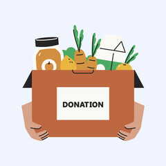 Supporting The Community With A Box Full Of Essential Groceries For Those In Need