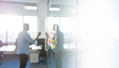 Marketing plan brainstorming sticky strategy business idea creativity note planning teamwork meeting modern office with glass wall and sticky